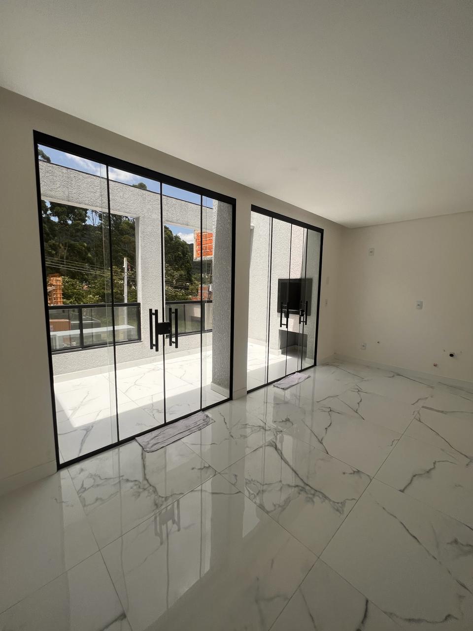 Sala com acesso à varanda do Valley Residence